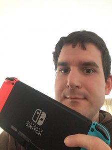 Benjamin Jones holding a Nintendo Switch