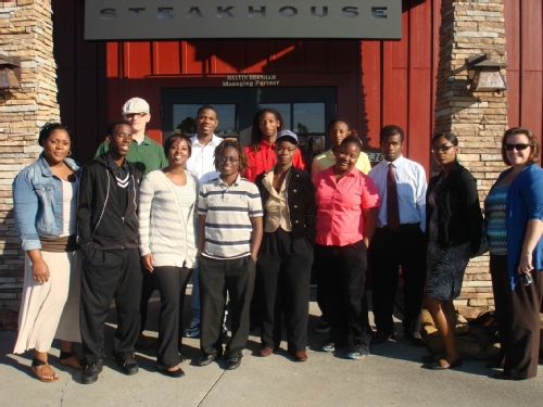 Participants from the Chris KIDS Independent Living Program in Atlanta close out their job shadowing/mentoring day at Longhorn Steakhouse with a memorable moment.