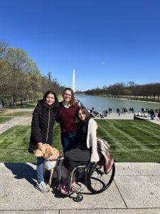 Emely Recinos, Carly Bastedo, Kaitlin Sommer in front of the Lincoln Memorial Reflecting Pool in Washington, D.C., with the Washington Monument rising in the backgroun